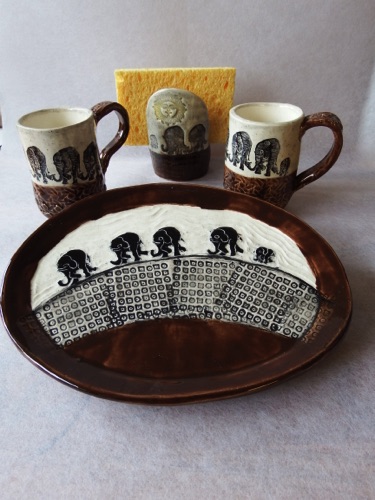 Elephant March
Set of Earthenware Plates, Mugs, & Spongeholder